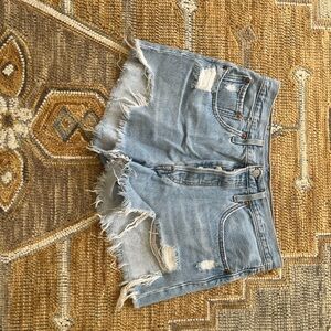 Light Blue Distressed Jean Shorts with Cut-Off Style